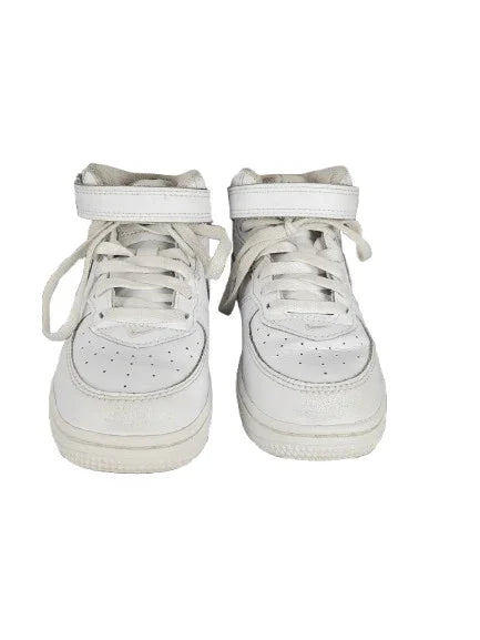Pair of white high-top sneakers on a white background