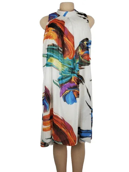 Colorful dress with abstract design on a mannequin against a white background