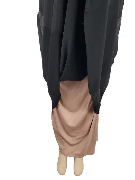Black and beige garment on a white background