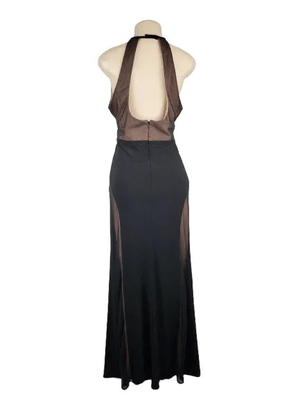 Black evening gown with sheer overlay on a mannequin against a white background