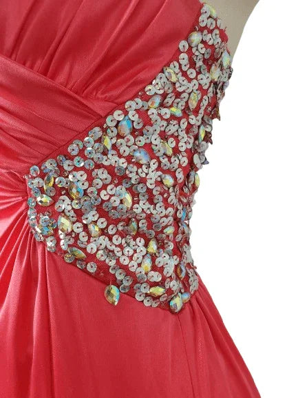Pink dress with a sequined embellishment on a white background