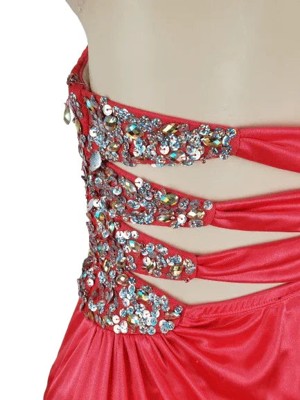 Pink evening gown with intricate beadwork on a white background