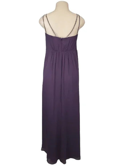 Purple dress on a mannequin against a white background