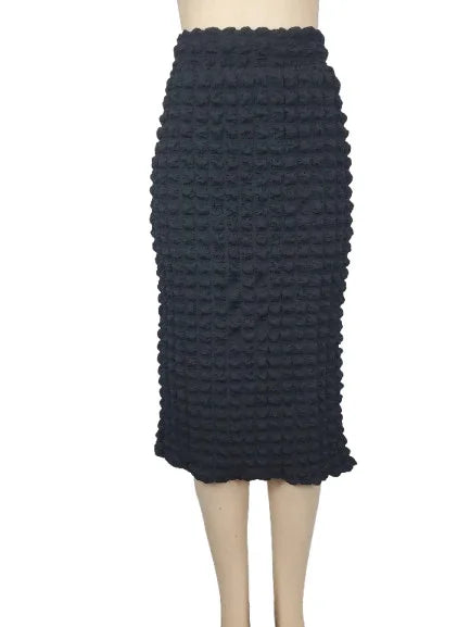 Black textured skirt on a mannequin against a white background