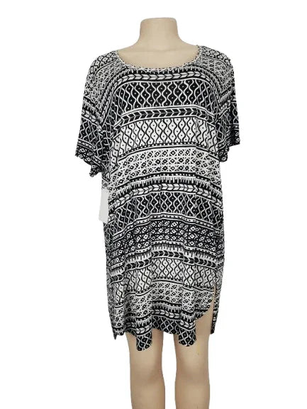 Black and white patterned dress on a mannequin against a white background