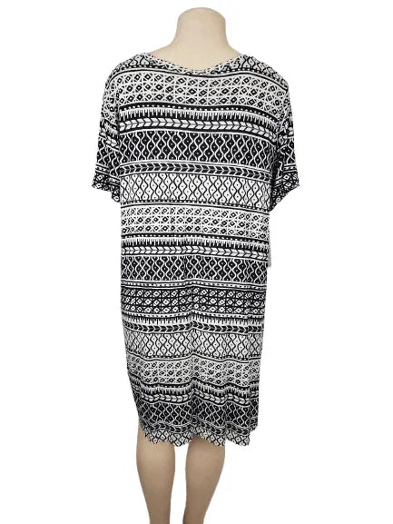 Black and white patterned dress on a mannequin against a white background