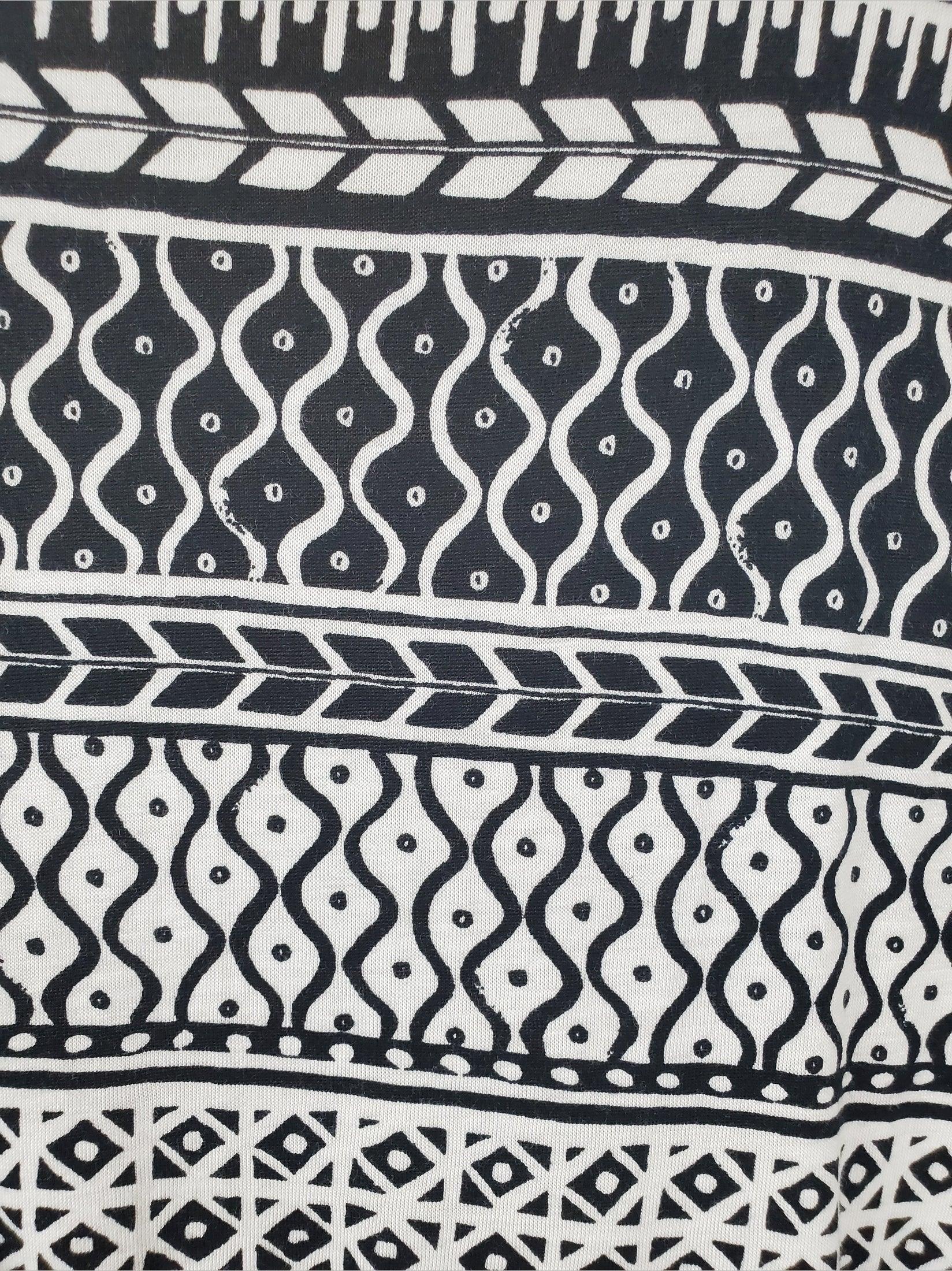 Black and white patterned fabric with various designs
