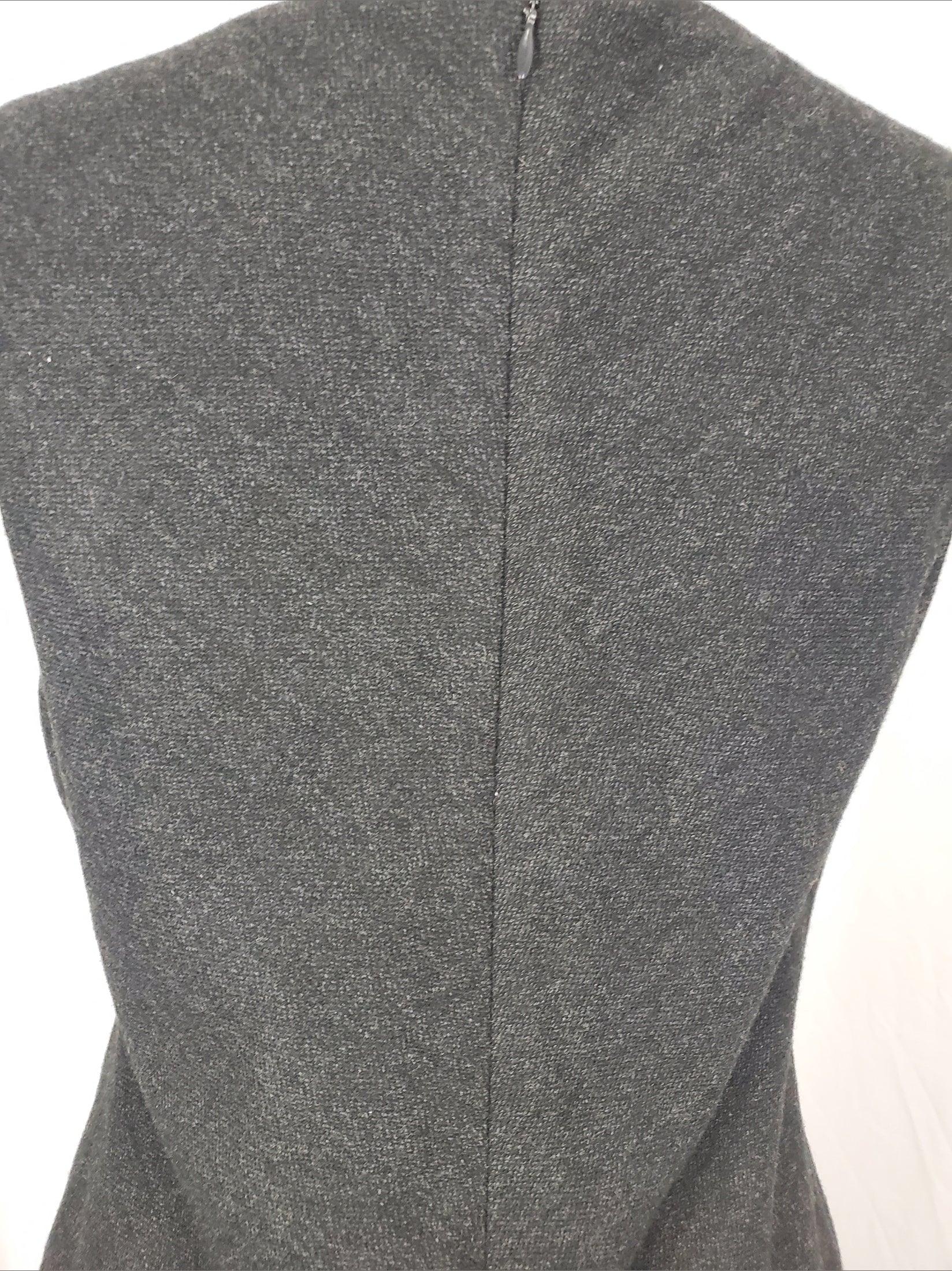 Close-up of gray fabric with a subtle pattern on a white background