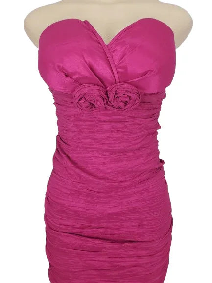 Pink strapless dress on a mannequin against a white background