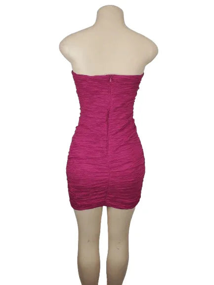 Pink strapless dress on a mannequin against a white background