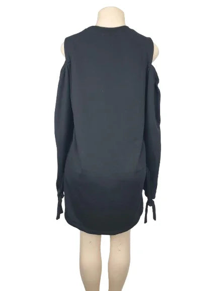 Black sleeveless dress on a mannequin against a white background