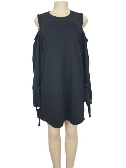 Black sleeveless dress on a mannequin against a white background