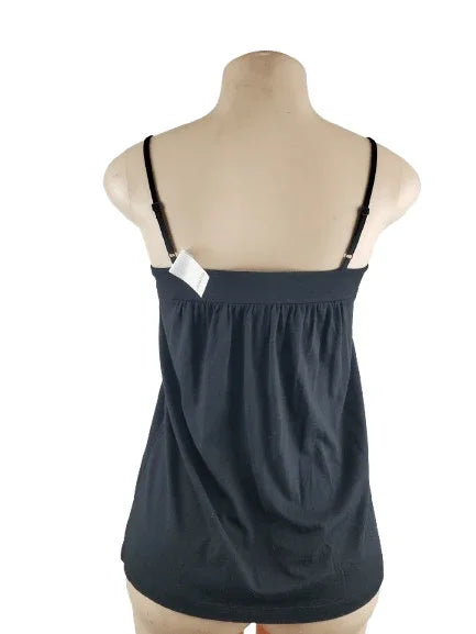 Black tank top on a mannequin with a white background