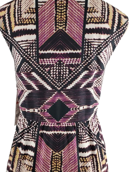 Geometric patterned dress on a mannequin against a white background
