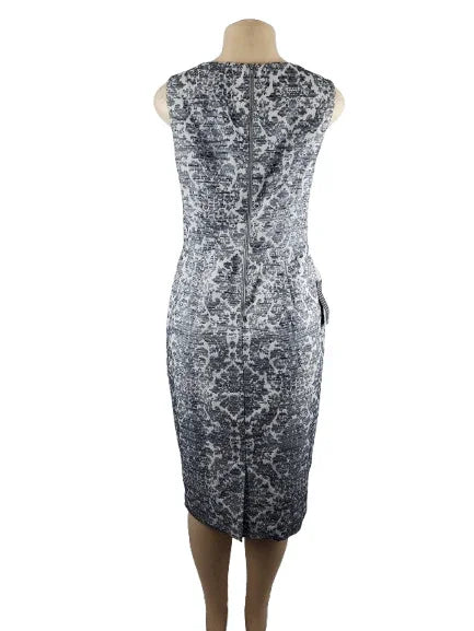 Blue and white patterned dress on a mannequin against a white background