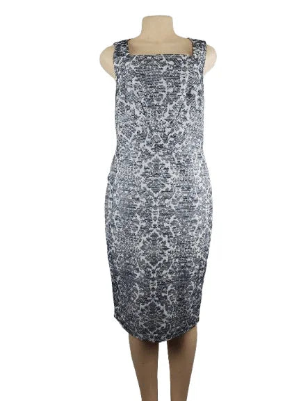 Blue and white patterned dress on a mannequin against a white background