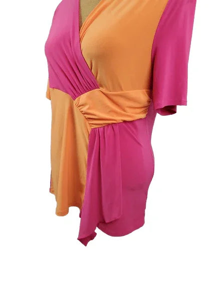 Two-tone pink and orange dress on a white background
