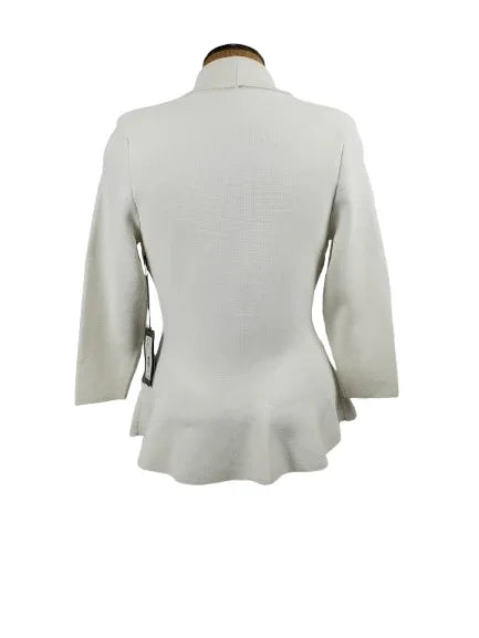 white top on a mannequin against a white background