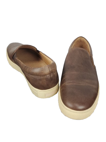 Pair of brown leather slip-on shoes on a white background