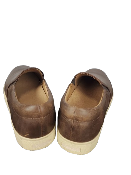 Pair of brown leather shoes on a white background