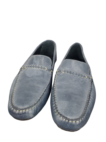 Pair of blue loafers on a white background