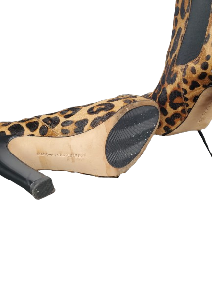 Leopard print high heel shoe on a white background