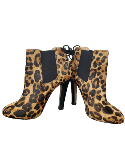 Leopard print ankle boots with black soles on a white background