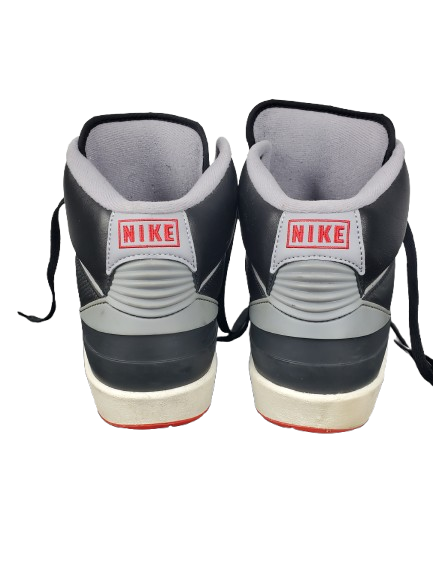 Pair of black and gray Nike sneakers on a white background