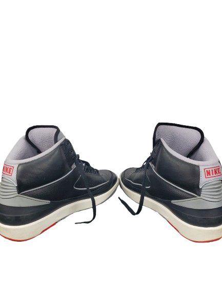 Pair of black and gray Nike sneakers on a white background