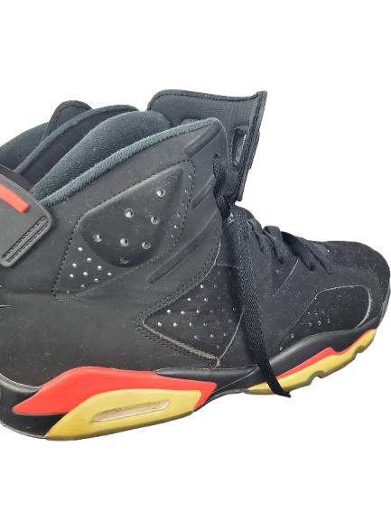 Black high-top sneakers with red and yellow accents on a white background