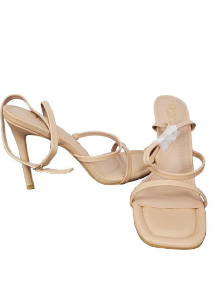 Beige high-heeled sandals with thin straps on a white background