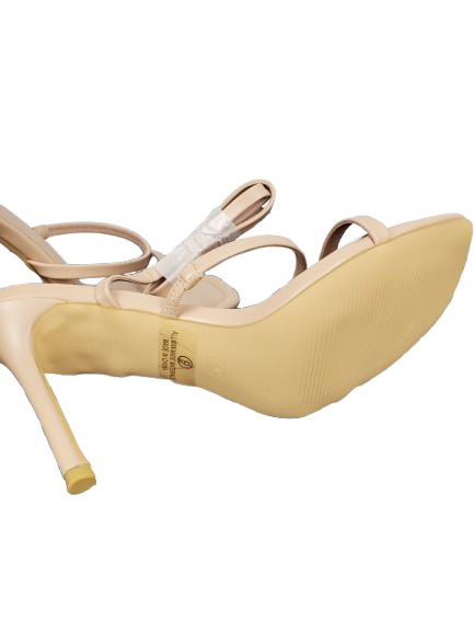 Beige high-heeled shoes with a brand logo on a white background
