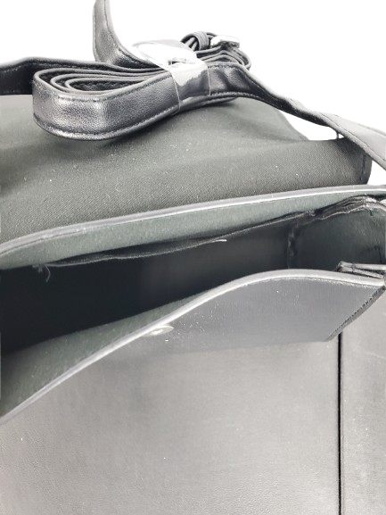 Close-up of a car's side mirror with a strap on a white background