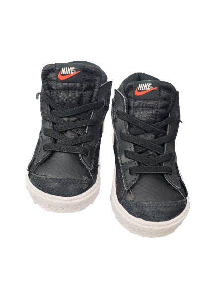 Pair of black Nike high-top sneakers on a white background