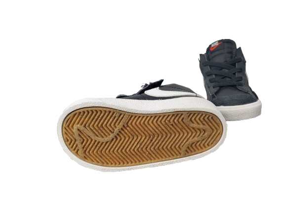 Navy high-top sneakers with white soles on a white background