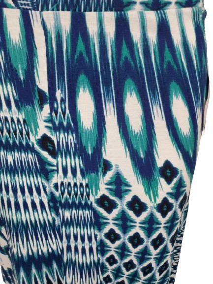 Close-up of a patterned fabric with blue, green, and white colors.