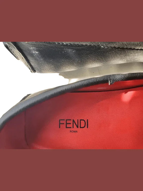 Red Fendi bag with black logo on a white background