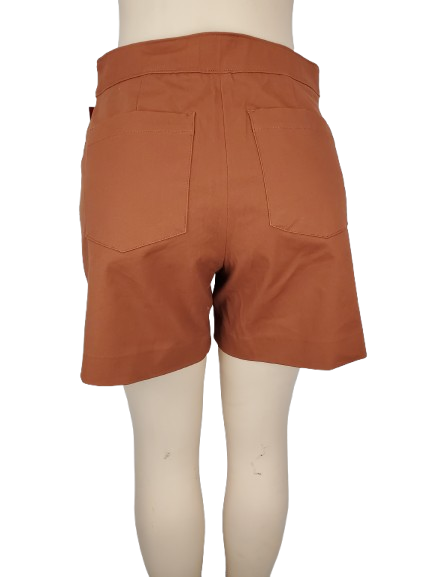 Brown shorts on a mannequin with a white background