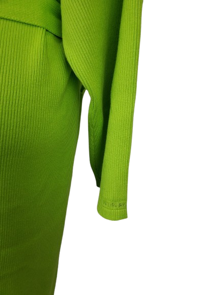 Close-up of a green ribbed sweater on a white background