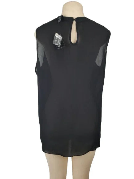 Black sleeveless top on a mannequin with a white background