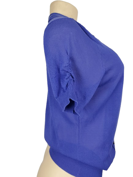 Blue sweater on a mannequin against a white background