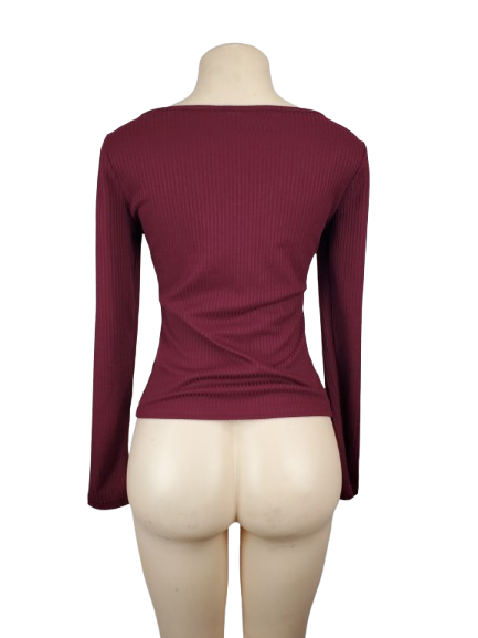 Maroon long-sleeve top on a mannequin against a white background