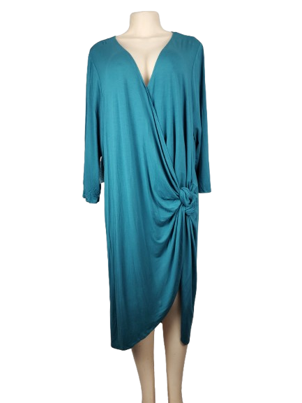 Teal dress on a mannequin against a white background