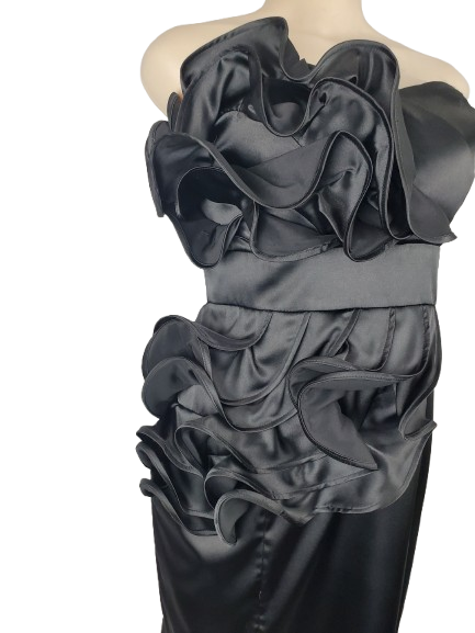 black strapless dress with ruffled top on a mannequin against a white background