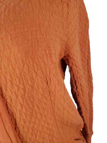 Women’s orange textured zip-up hoodie with tie detail and front pockets displayed on mannequin.