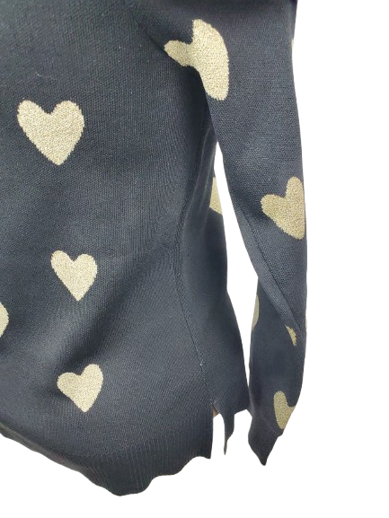 black sweater with gold heart patterns on a white background