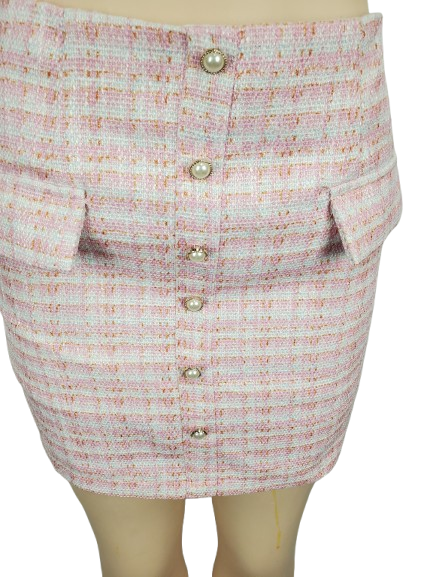 Skirt with button details on a mannequin against a white background