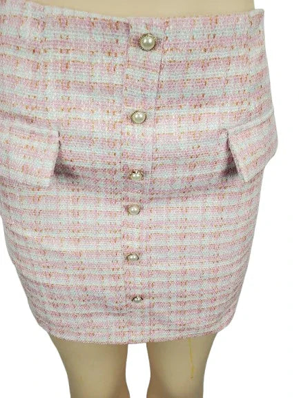 Skirt with button details on a mannequin against a white background
