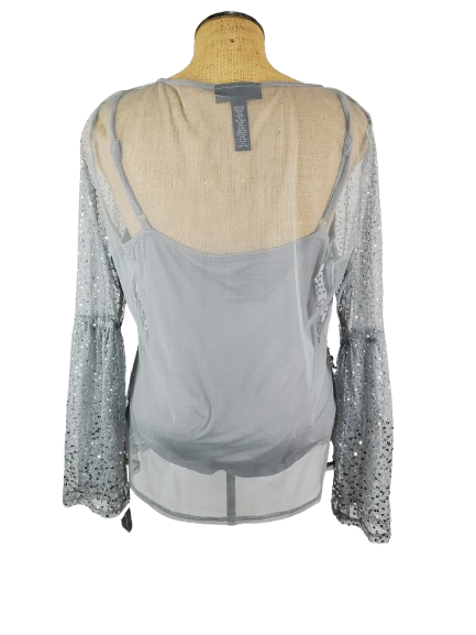 Gray blouse with sheer sleeves on a mannequin against a white background