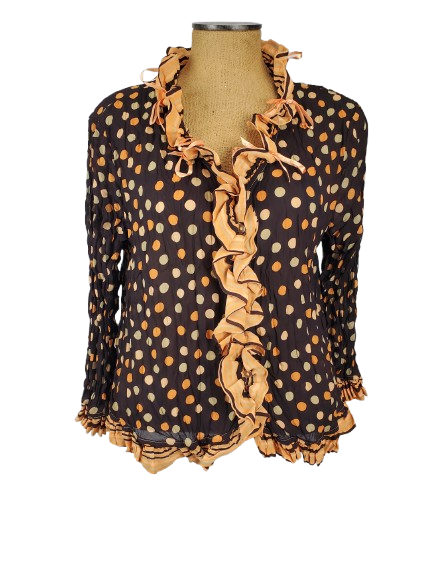 brown blouse with orange polka dots and ruffled trim on a mannequin against a white background